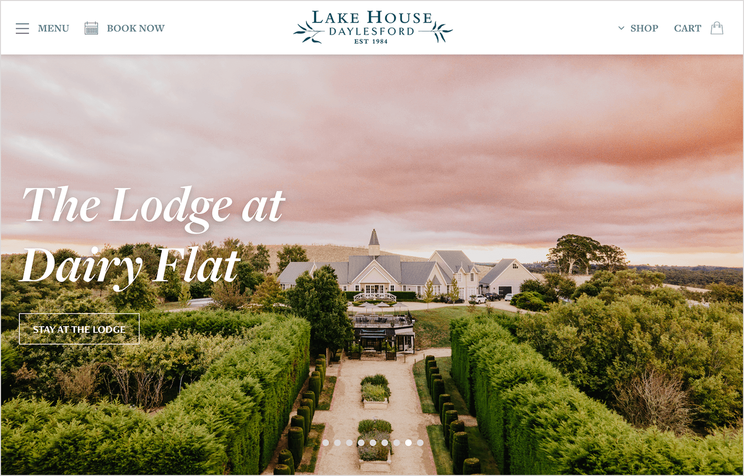 Elegant hotel website design with soft color palette and lakeside views.