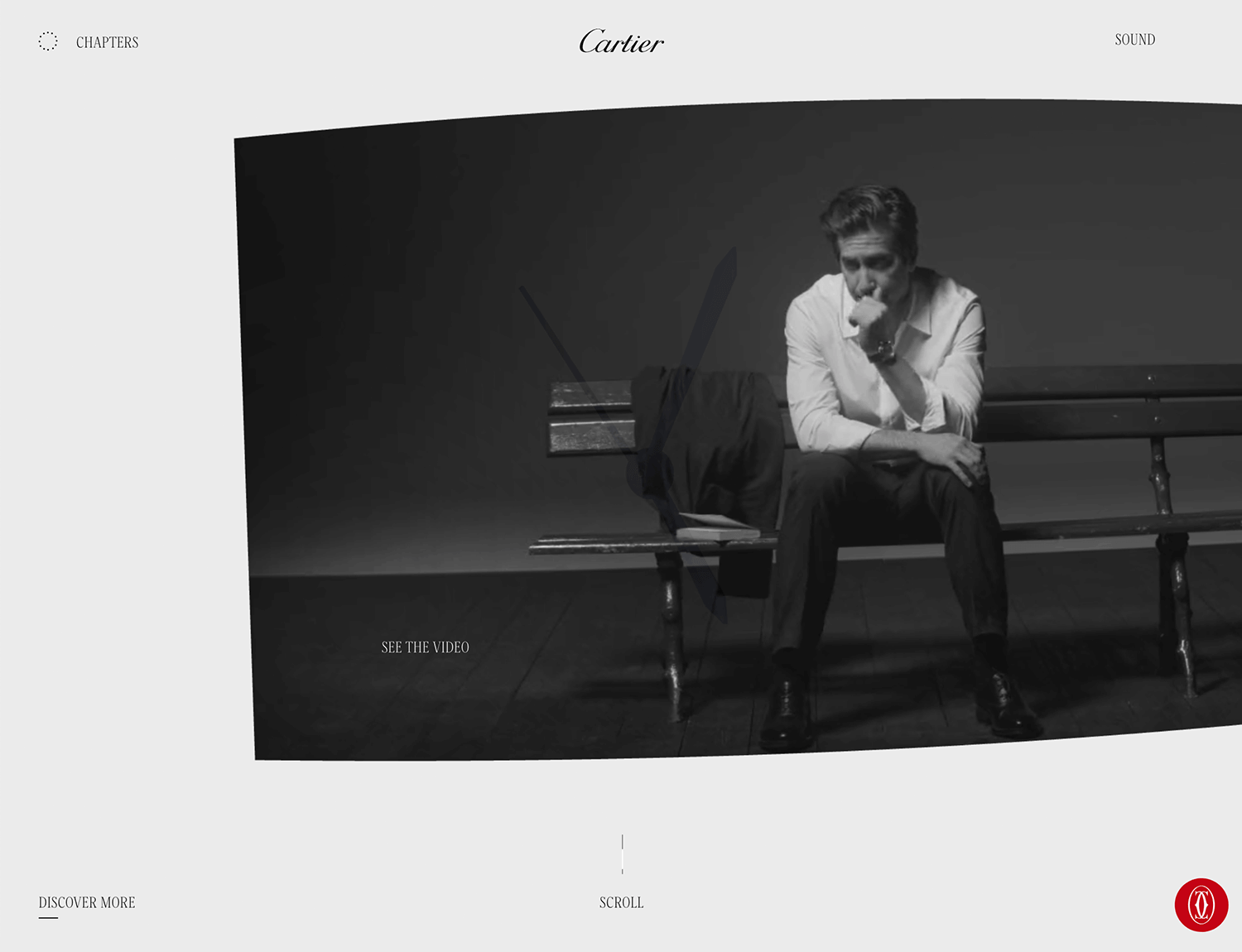 Cartier's website showcasing a man sits on a bench, contemplating, with minimalistic navigation elements surrounding him