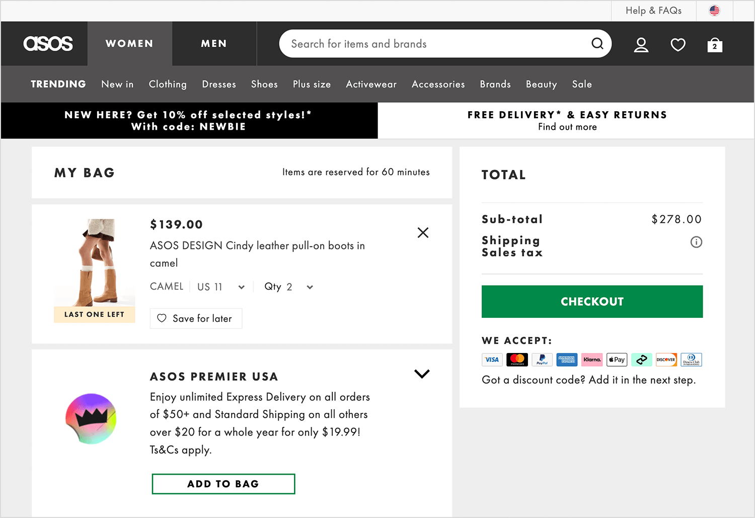 ASOS shopping cart page displaying leather boots, order summary, checkout button, and payment options