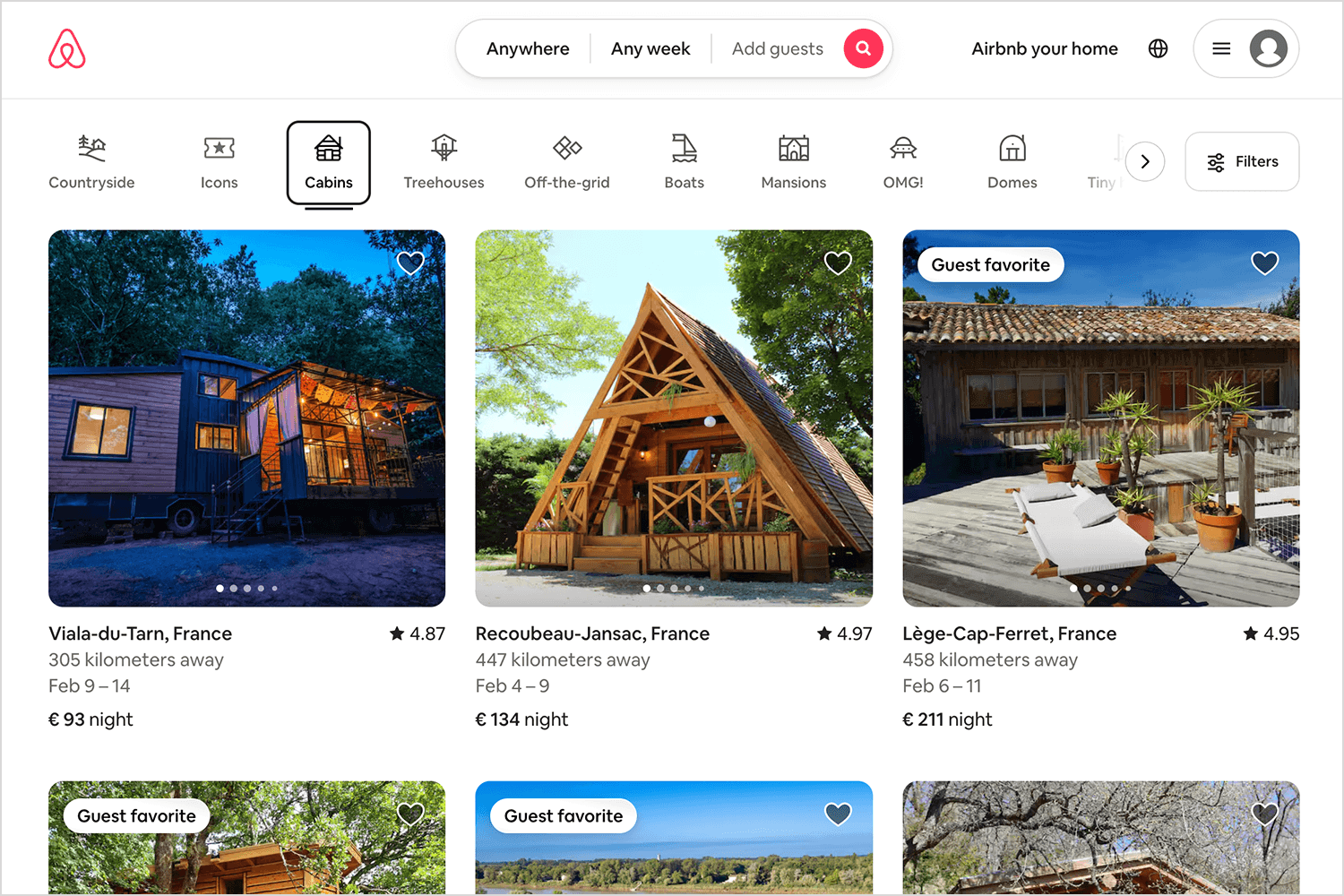 Airbnb search results displaying cabin rentals with filters and pagination options